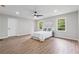 Main bedroom with wood-look floors, neutral walls, ceiling fan and natural light at 1232 Andrews Dr, Marietta, GA 30062