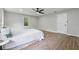 Well-lit main bedroom featuring wood-look floors, a ceiling fan, and large windows at 1232 Andrews Dr, Marietta, GA 30062