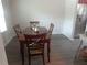 Inviting dining room featuring a dark wood table and easy access to the kitchen area at 1325 Sandlewood Ct, Lithonia, GA 30058
