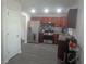 Well-lit kitchen featuring stainless steel appliances and wooden cabinetry at 1325 Sandlewood Ct, Lithonia, GA 30058