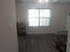 Light filled room with laminate flooring, a window, and neutral paint at 1325 Sandlewood Ct, Lithonia, GA 30058