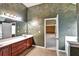 Bathroom with granite countertops, bronze fixtures, framed mirrors, designer paint and tile flooring at 159 Molly Way, Mcdonough, GA 30253