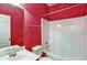 Bathroom with a single sink vanity, tile floors, and combination tub and shower at 159 Molly Way, Mcdonough, GA 30253