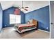 Charming bedroom with blue walls, natural light, and vaulted ceiling with ceiling fan at 159 Molly Way, Mcdonough, GA 30253