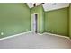 Bedroom with green walls, carpet, and a closet at 159 Molly Way, Mcdonough, GA 30253