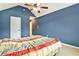 Bedroom featuring blue walls, a fan, vaulted ceiling, and carpet floors at 159 Molly Way, Mcdonough, GA 30253