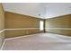 Cozy bedroom with a vaulted ceiling, neutral carpeting, and ample natural light at 159 Molly Way, Mcdonough, GA 30253