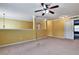 Bedroom space featuring yellow walls, a ceiling fan, and neutral carpet at 159 Molly Way, Mcdonough, GA 30253