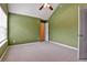 Empty bedroom features a ceiling fan, carpet, and neutral wall color at 159 Molly Way, Mcdonough, GA 30253