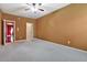 View of bedroom with plush carpeting, ceiling fan, and multiple doorways and a closet at 159 Molly Way, Mcdonough, GA 30253