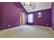 Bedroom features plush carpet with a vaulted ceiling, ceiling fan, and a sunlit window dressed with curtains at 159 Molly Way, Mcdonough, GA 30253