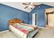 Cozy bedroom features a comfy bed, vaulted ceiling with a fan, and a closet at 159 Molly Way, Mcdonough, GA 30253