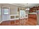 Large dining room with custom cabinets, decorative molding and hardwood floors at 159 Molly Way, Mcdonough, GA 30253