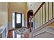 Spacious entryway featuring hardwood floors, staircase, and decorative rug, creating a welcoming atmosphere at 159 Molly Way, Mcdonough, GA 30253
