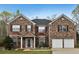 Beautiful two-story brick home featuring a classic design and well-maintained landscaping at 159 Molly Way, Mcdonough, GA 30253