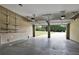 Two car garage with automatic door openers and shelving at 159 Molly Way, Mcdonough, GA 30253