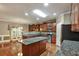 Well-appointed kitchen features granite countertops, center island, and modern appliances at 159 Molly Way, Mcdonough, GA 30253