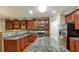Bright kitchen with stainless appliances, granite countertops, tile backsplash, and hardwood floors at 159 Molly Way, Mcdonough, GA 30253