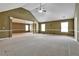 Large living room with carpet, high ceilings, and decorative pillars at 159 Molly Way, Mcdonough, GA 30253