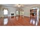 Open living room features hardwood floors, fireplace, and seamless flow into kitchen at 159 Molly Way, Mcdonough, GA 30253