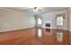 Spacious living room showcasing hardwood floors, fireplace, and neutral wall color at 159 Molly Way, Mcdonough, GA 30253