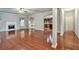 Open-concept living room with hardwood floors, fireplace, and easy access to kitchen at 159 Molly Way, Mcdonough, GA 30253