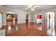 Expansive living room with hardwood floors, arched doorways, and connections to other rooms at 159 Molly Way, Mcdonough, GA 30253