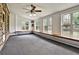 Bright sunroom with large windows, window seat, and views of the landscaped backyard at 159 Molly Way, Mcdonough, GA 30253