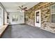 Spacious sunroom featuring large windows and a white door leading to the backyard at 159 Molly Way, Mcdonough, GA 30253