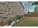 Home's yard featuring flowerbeds, fencing, and lawn at 159 Molly Way, Mcdonough, GA 30253