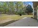 Grassy backyard featuring a concrete slab at 3937 Sautee Trl, Conley, GA 30288