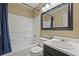 Cozy bathroom features a shower-tub combo, and dark vanity at 3937 Sautee Trl, Conley, GA 30288
