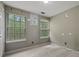 Carpeted bedroom with neutral paint, and two windows providing natural light at 3937 Sautee Trl, Conley, GA 30288
