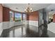 Formal dining room with hardwood floors, wainscoting, bay window, and chandelier at 3937 Sautee Trl, Conley, GA 30288
