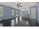 Open-concept living room featuring hardwood floors and access to the kitchen at 3937 Sautee Trl, Conley, GA 30288