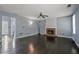 Spacious living room with hardwood floors and a brick fireplace at 3937 Sautee Trl, Conley, GA 30288