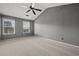 Main bedroom suite features vaulted ceilings, carpet, and a ceiling fan at 3937 Sautee Trl, Conley, GA 30288