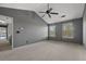 Main bedroom suite features vaulted ceilings, carpet, and a ceiling fan at 3937 Sautee Trl, Conley, GA 30288
