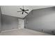 Main bedroom suite features vaulted ceilings, carpet, and a ceiling fan at 3937 Sautee Trl, Conley, GA 30288