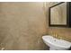 Modern powder room features a pedestal sink, decorative mirror, and stylish walls at 3937 Sautee Trl, Conley, GA 30288