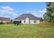 Large back yard with green grass and wood fence perfect for outdoor activities at 609 Alyssa Ct, Locust Grove, GA 30248