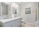 Bathroom featuring double sinks with marble countertop, tile floor, and natural light at 609 Alyssa Ct, Locust Grove, GA 30248