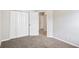 Empty bedroom with closet and neutral carpet at 609 Alyssa Ct, Locust Grove, GA 30248