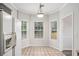 Cozy breakfast nook featuring three sunny windows and a decorative light fixture at 609 Alyssa Ct, Locust Grove, GA 30248