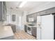Well-maintained kitchen with tile floors, updated appliances, and ample counter space at 609 Alyssa Ct, Locust Grove, GA 30248