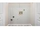 Laundry room rough-in with connections for washer and dryer with white vinyl floors at 609 Alyssa Ct, Locust Grove, GA 30248