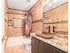 Stylish bathroom featuring a vessel sink, tiled walls, and a tub shower combo at 125 Russell Rd, Lawrenceville, GA 30043