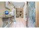 Inviting foyer featuring a tile floor, glass paneled door, and view into the living room at 125 Russell Rd, Lawrenceville, GA 30043