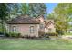 Charming one-story home featuring a well-manicured lawn and mature landscaping in a suburban setting at 125 Russell Rd, Lawrenceville, GA 30043