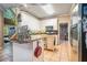 Bright and functional kitchen featuring tile floors, white cabinetry, and a central island at 125 Russell Rd, Lawrenceville, GA 30043